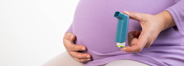 Pregnant woman with inhaler