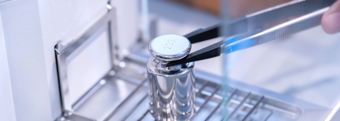 Calibration weight placed on analytical balance
