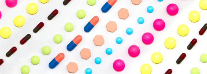 Different pills laid out in lines